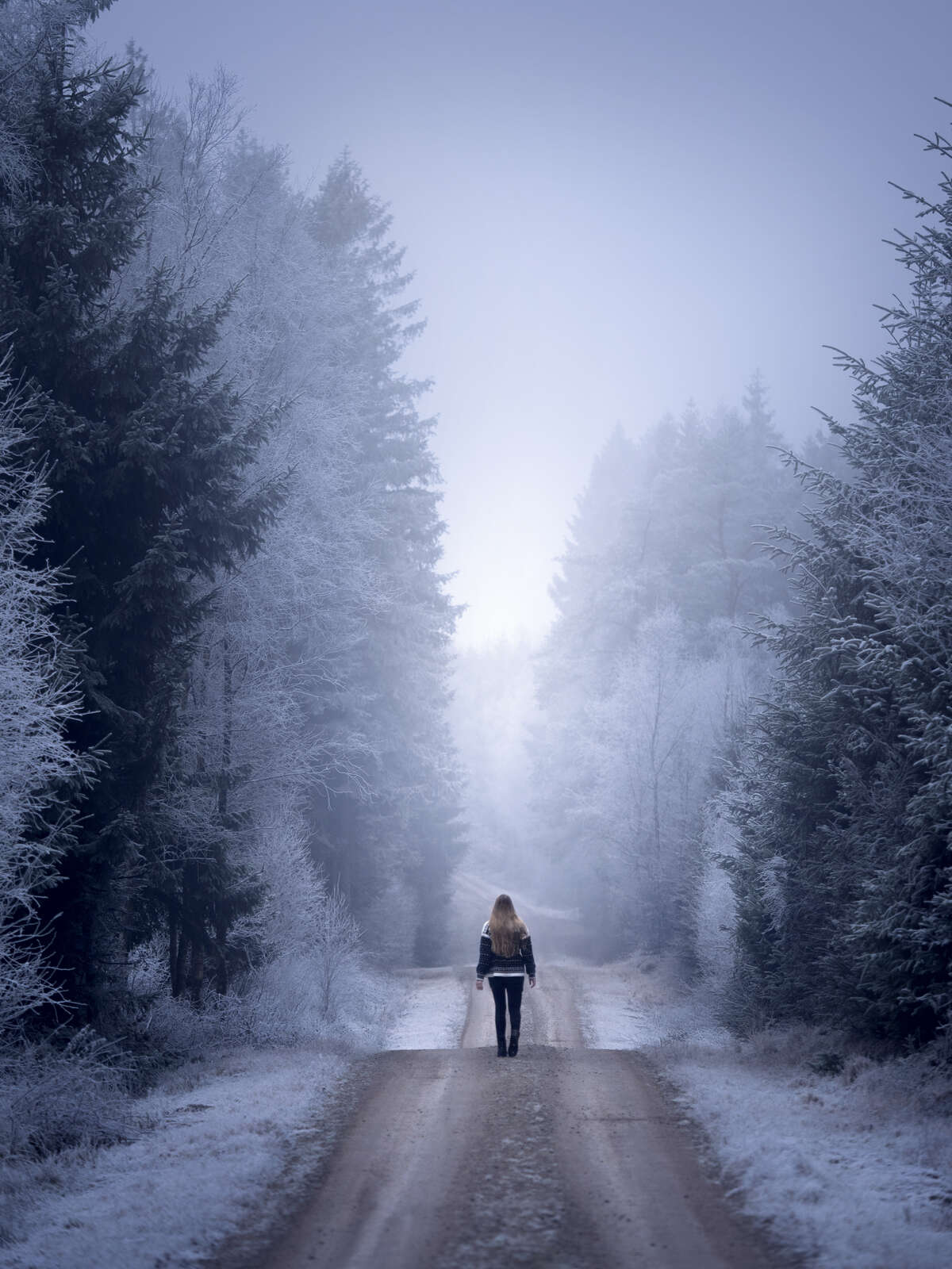 Woman in Snowy Woods