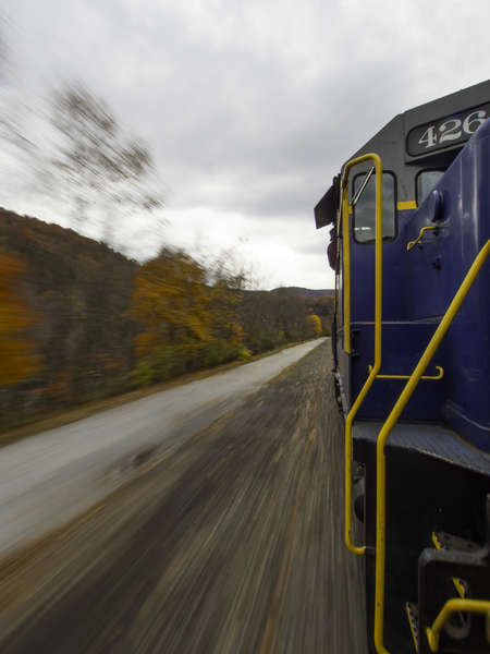 Moving train through autumn scene