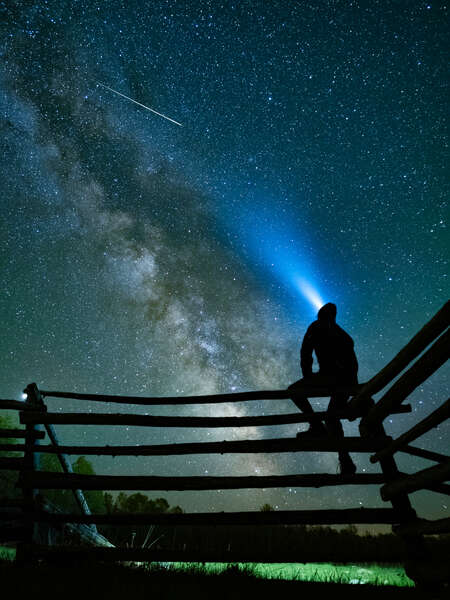 Man on Fence with Milky Way