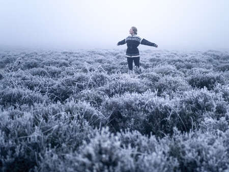 Woman in Snowy Field